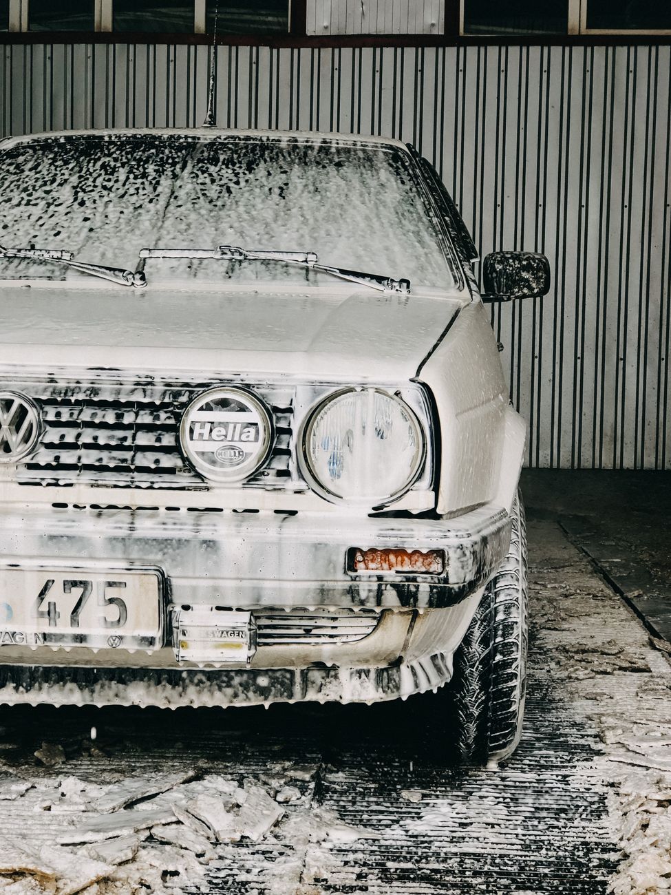 volkswagen car being washed in a garage